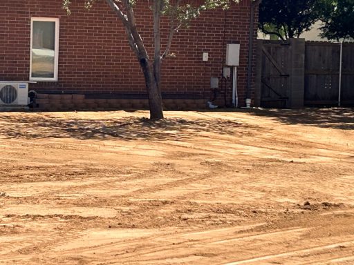 Skid Steer work in a backyard